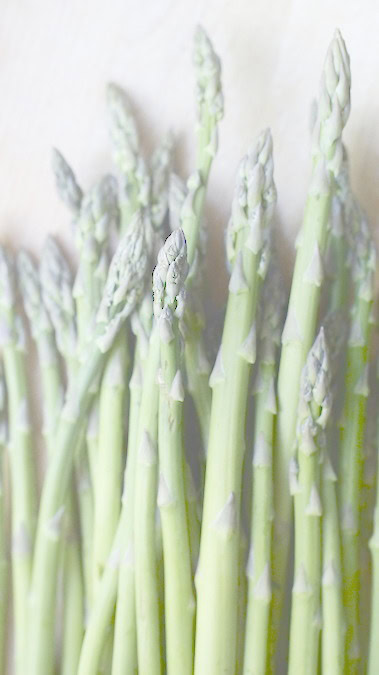 Fresh green asparagus stalks ready for roasting.
