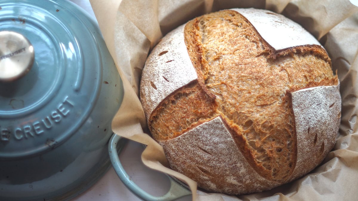 close-up of a sourdough loaf on parchment paper