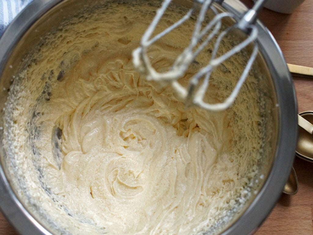 Butter, sugar and eggs have been beaten until pale, airy and foamy,