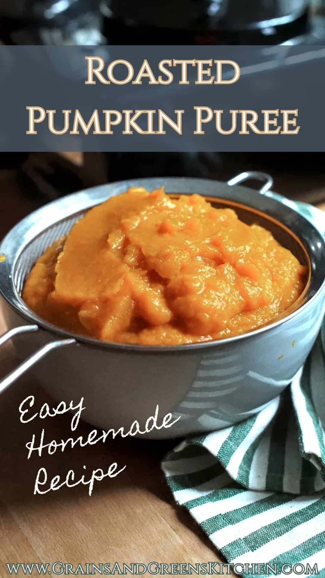 Roasted Pumpkin Puree sitting in a fine mesh sieve over a pale blue bowl, draining after blending in a food processor.