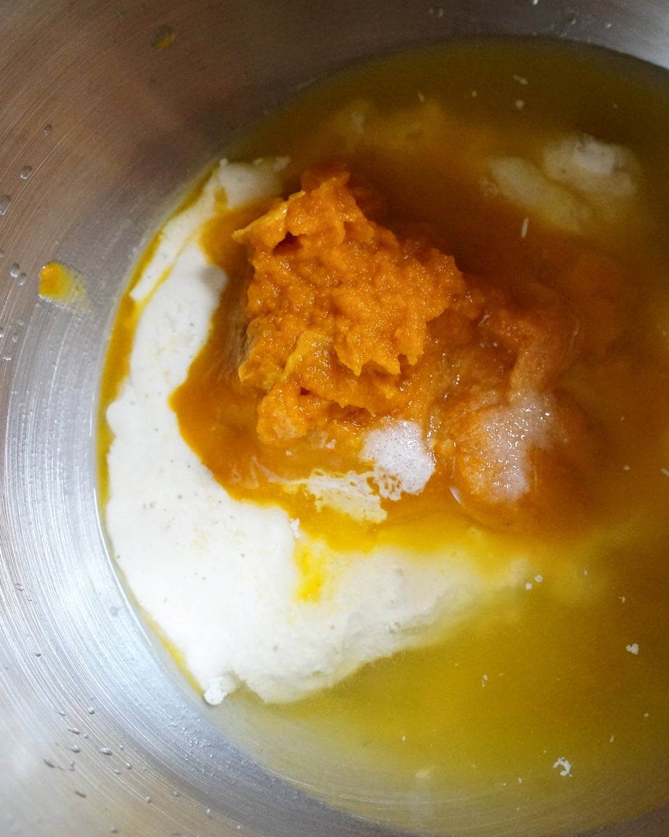 All wet ingredients for pumpkin sourdough bagels combined in a stainless steel bowl.